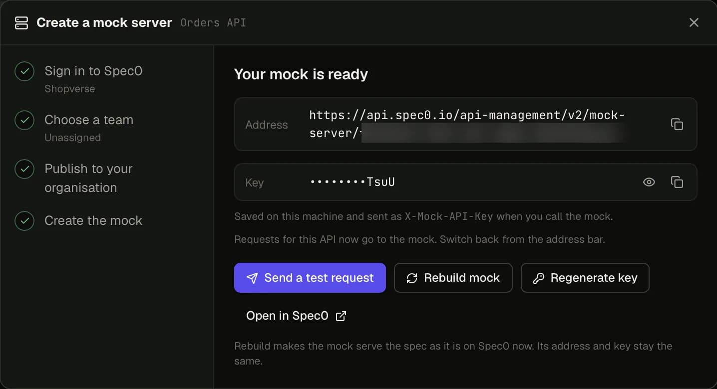 The Create a mock server dialog with all four steps ticked and 'Your mock is ready': the address (part of it blurred), a masked key, and buttons for Send a test request, Rebuild mock, Regenerate key and Open in Spec0.